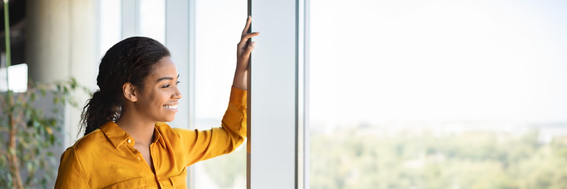Confident businesswoman standing outdoors with a calm expression.